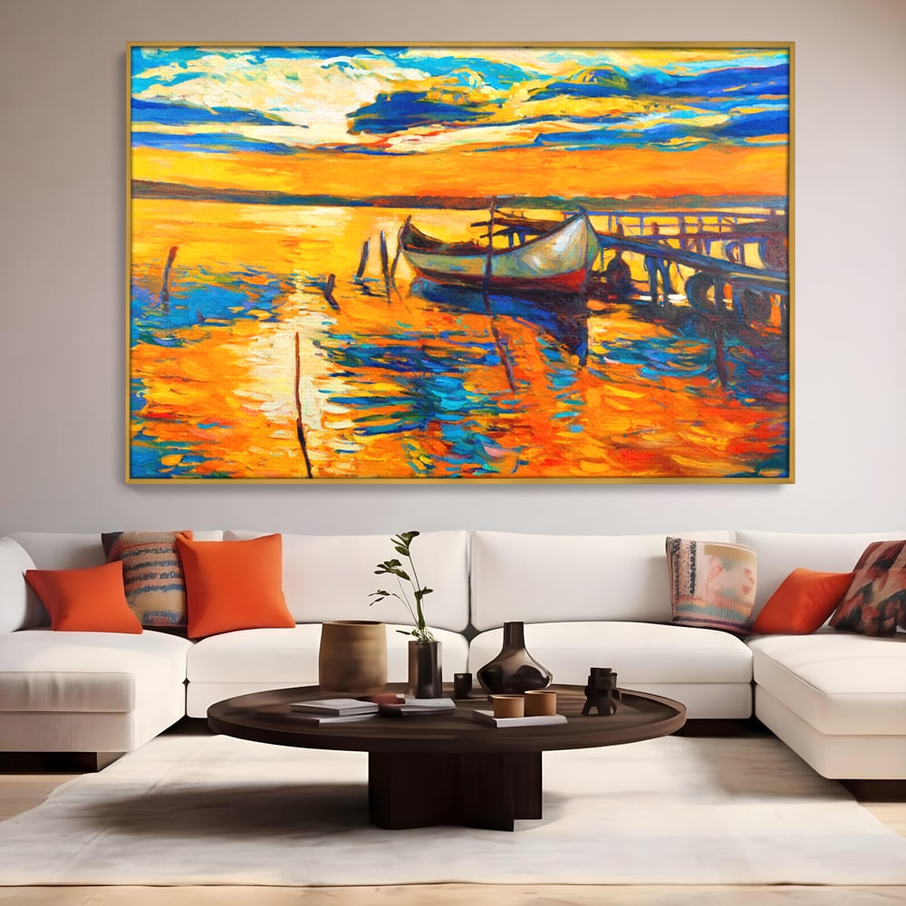 Tablou canvas cu pictura cu barca la apus, in rama de aluminiu auriu, pe perete intr-un living