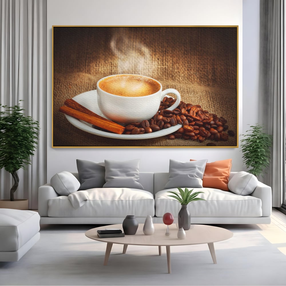 Tablou canvas cu tablou canvas cu ceasca de cafea si scortisoara, in rama de aluminiu auriu, pe perete intr-un living