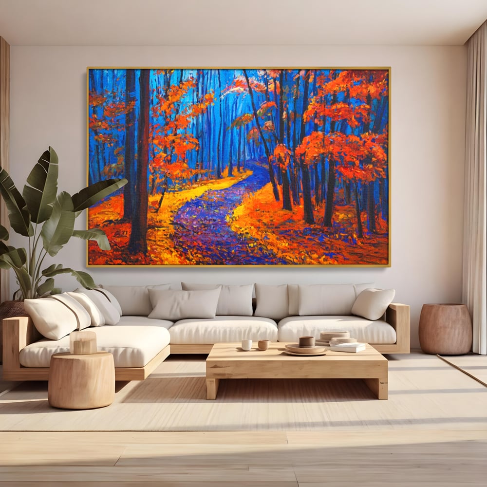 Tablou canvas cu pictura cu padure de toamna si poteca, in rama de aluminiu auriu, pe perete intr-un living