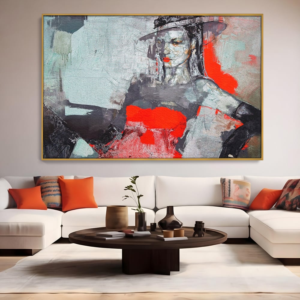 Tablou canvas cu tablou canvas cu portretul unei femei in rosu si negru, in rama de aluminiu auriu, pe perete intr-un living
