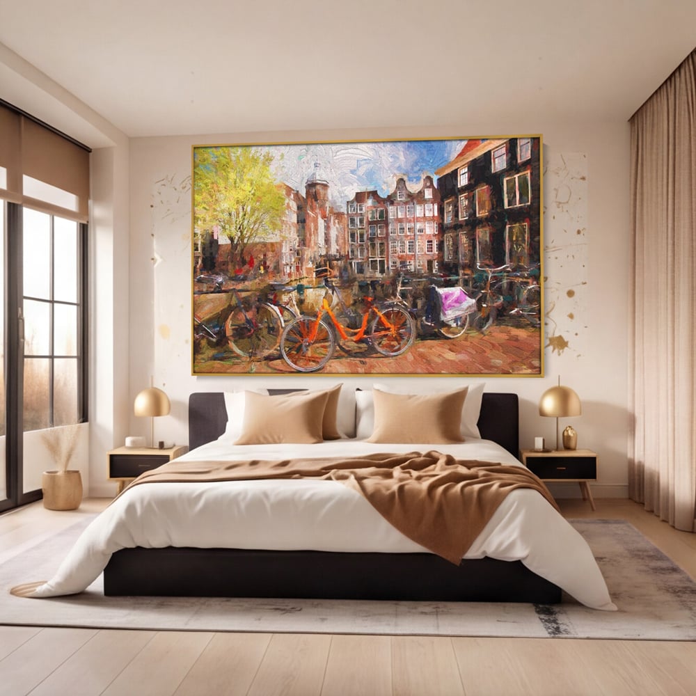 Tablou canvas cu tablou canvas cu bicicleta portocalie pe malul canalului, in rama de aluminiu auriu, pe perete intr-un dormitor