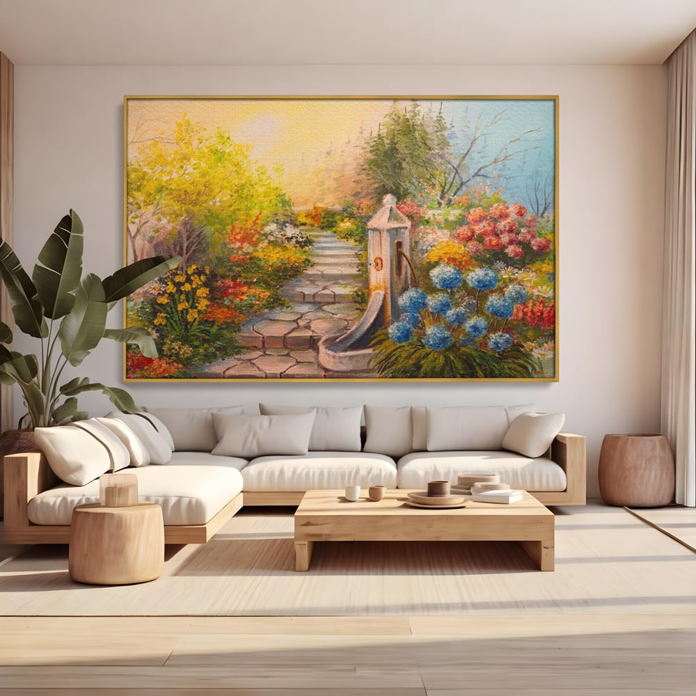 Tablou canvas cu pictura decorativa cu alee florala si fantana, in rama de aluminiu auriu, pe perete intr-un living