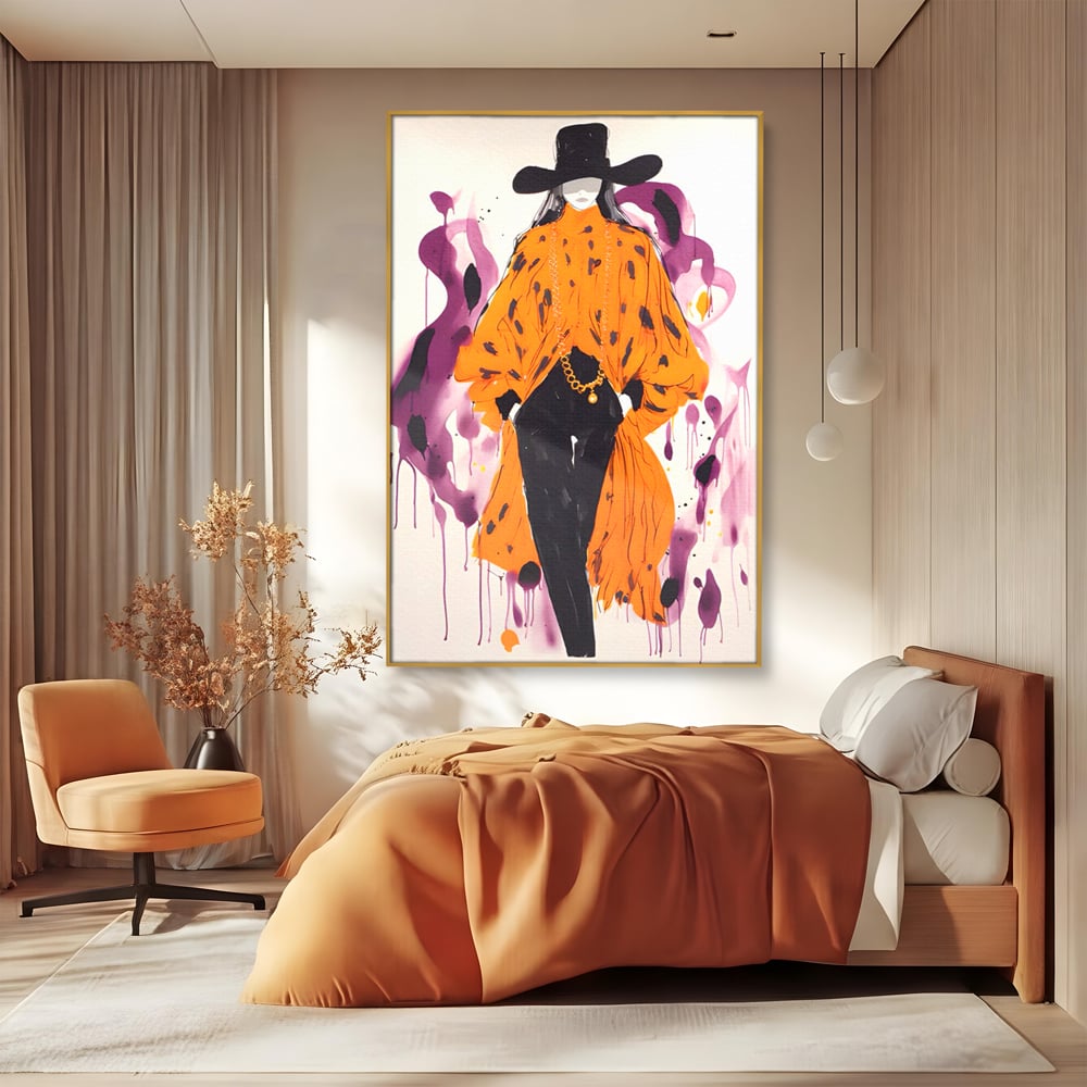 Tablou canvas cu ilustratie fashion cu femeie in costum portocaliu, in rama de aluminiu auriu, pe perete intr-un dormitor
