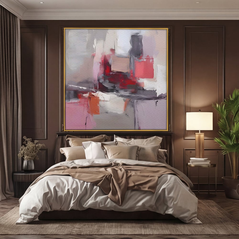 Tablou canvas cu pictura abstracta cu blocuri rosii si gri, in rama de aluminiu auriu, pe perete intr-un dormitor