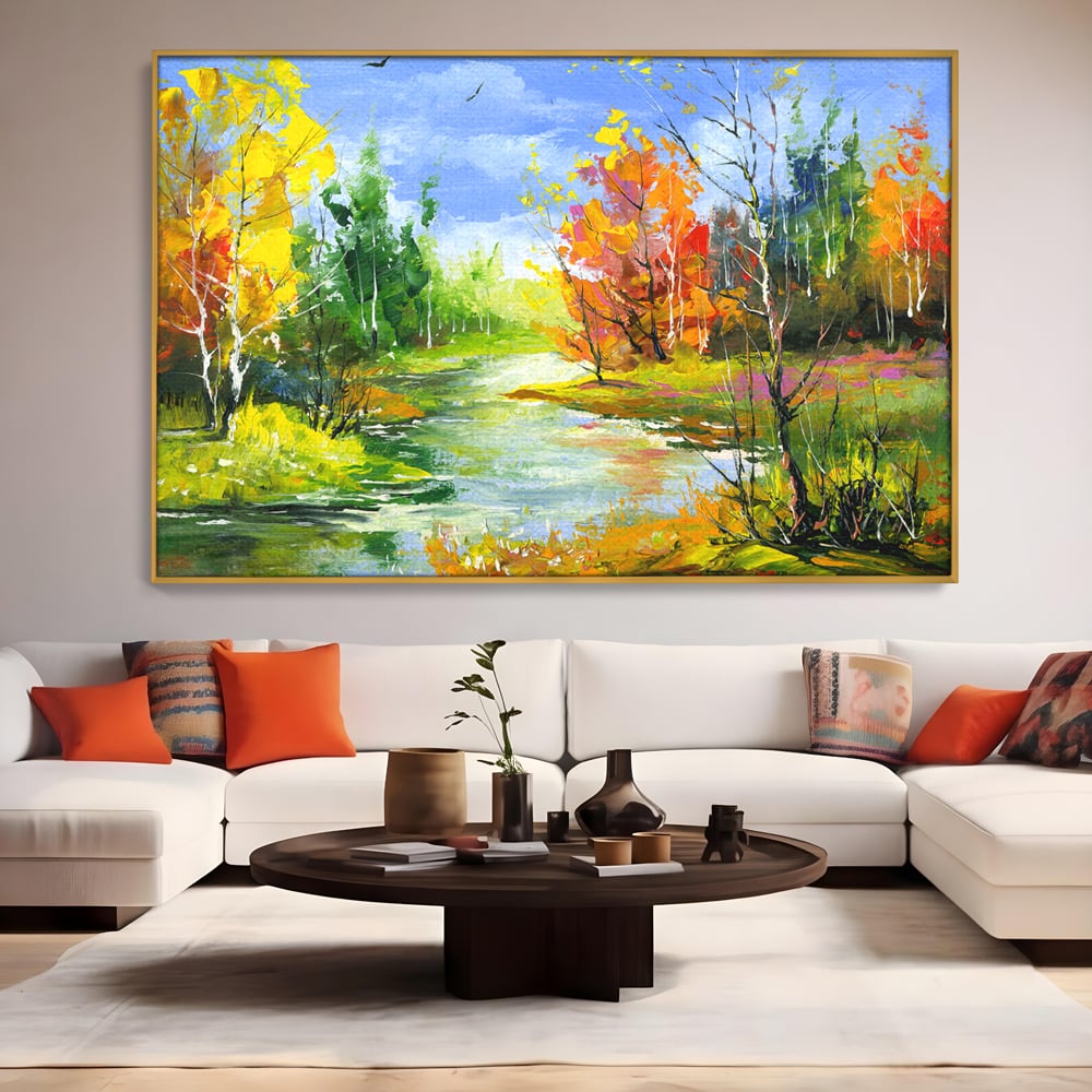 Tablou canvas cu pictura peisaj de toamna cu rau, in rama de aluminiu auriu, pe perete intr-un living