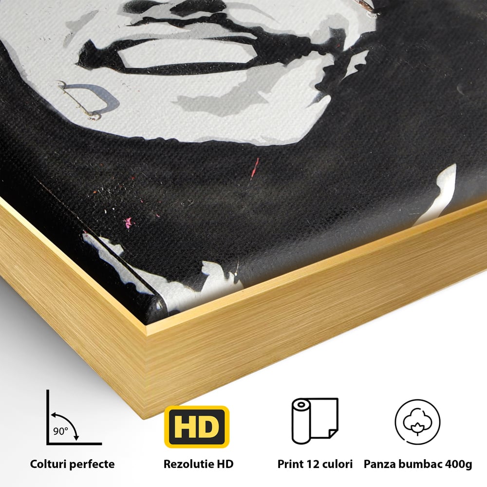 Detaliu al suprafetei: tablou pictat cu portretul lui bob marley, in rama de aluminiu auriu