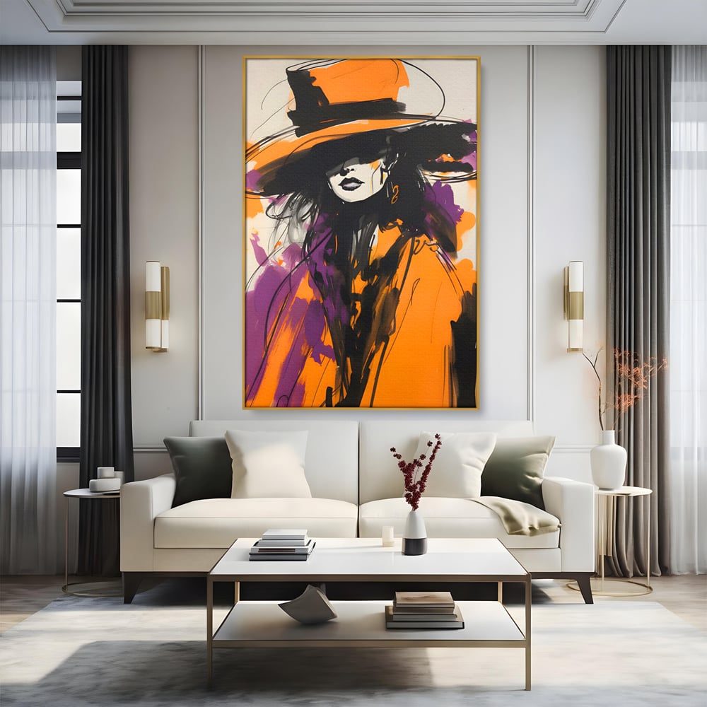 Tablou canvas cu ilustratie portret femeie cu palarie portocalie, in rama de aluminiu auriu, pe perete intr-un living