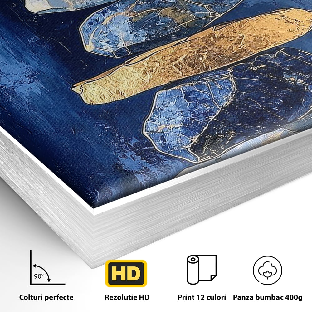 Detaliu al suprafetei: tablou canvas cu stive de pietre si cerc auriu, in rama de aluminiu argintiu