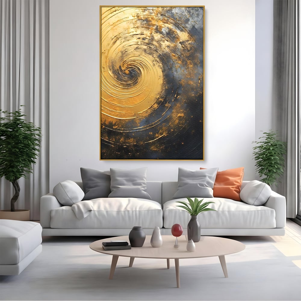 Tablou canvas cu pictura abstracta cu spirala aurie, in rama de aluminiu auriu, pe perete intr-un living