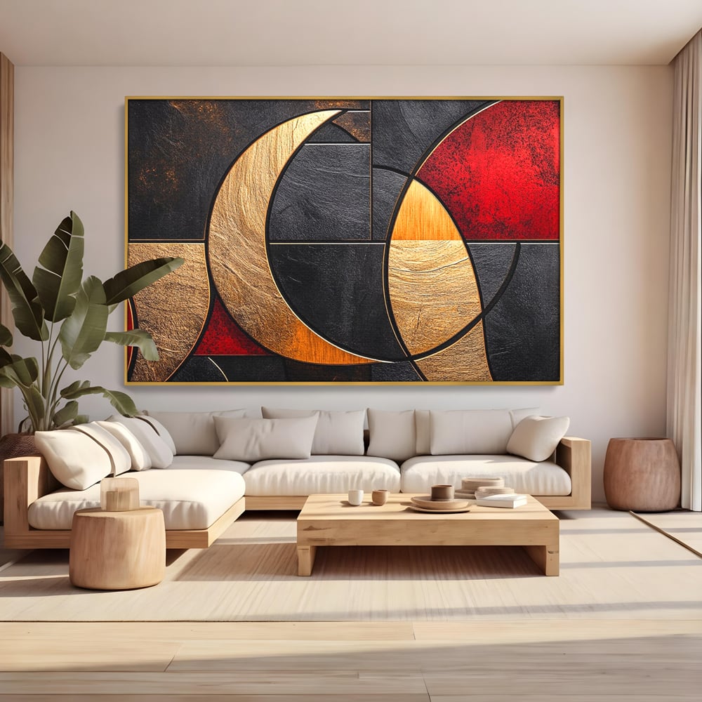 Tablou canvas cu tablou canvas cu forme geometrice aurii si rosii, in rama de aluminiu auriu, pe perete intr-un living