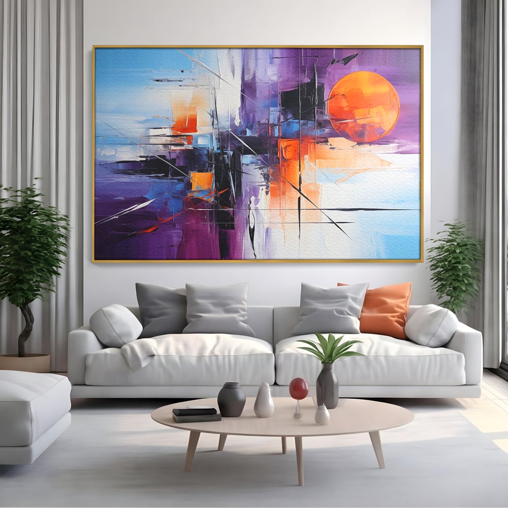 Tablou canvas cu pictura abstracta cu soare portocaliu, in rama de aluminiu auriu, pe perete intr-un living