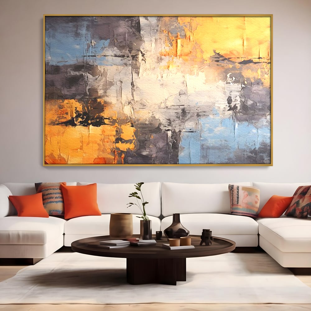 Tablou canvas cu pictura abstracta cu texturi portocalii si gri, in rama de aluminiu auriu, pe perete intr-un living