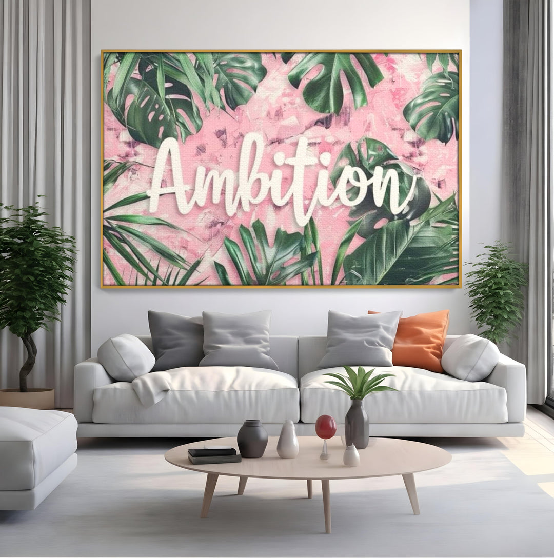 Tablou canvas cu tablou canvas cu frunze tropicale si text, in rama de aluminiu auriu, pe perete intr-un living