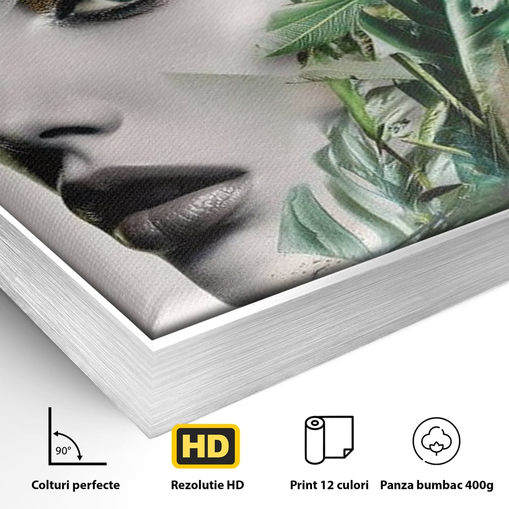 Detaliu al suprafetei: tablou canvas cu portret de femeie si frunze tropicale, in rama de aluminiu argintiu