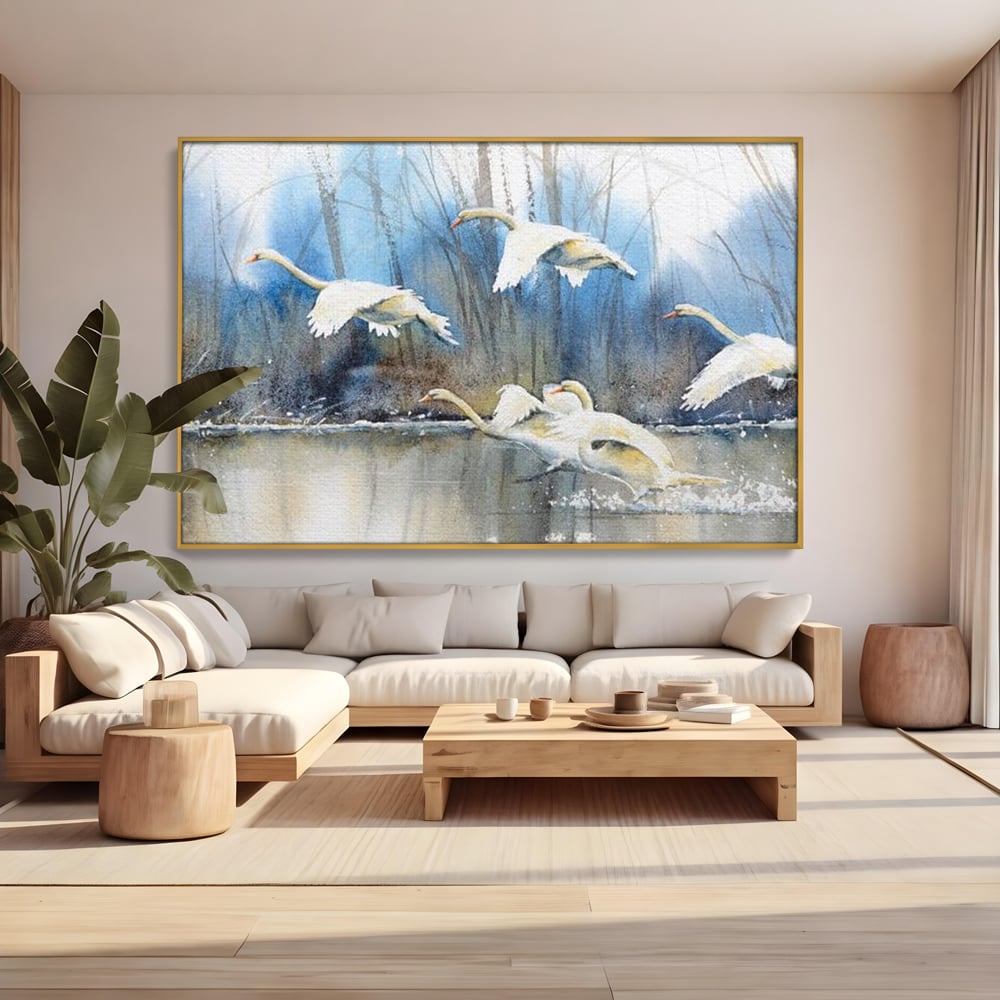 Tablou canvas cu pictura cu lebede pe apa, in rama de aluminiu auriu, pe perete intr-un living