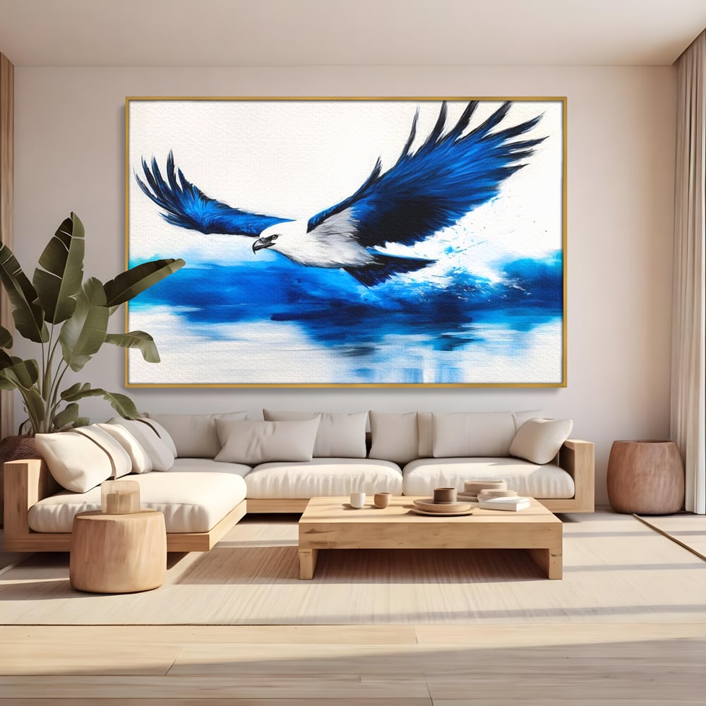 Tablou canvas cu tablou canvas cu vultur zburand peste apa, in rama de aluminiu auriu, pe perete intr-un living