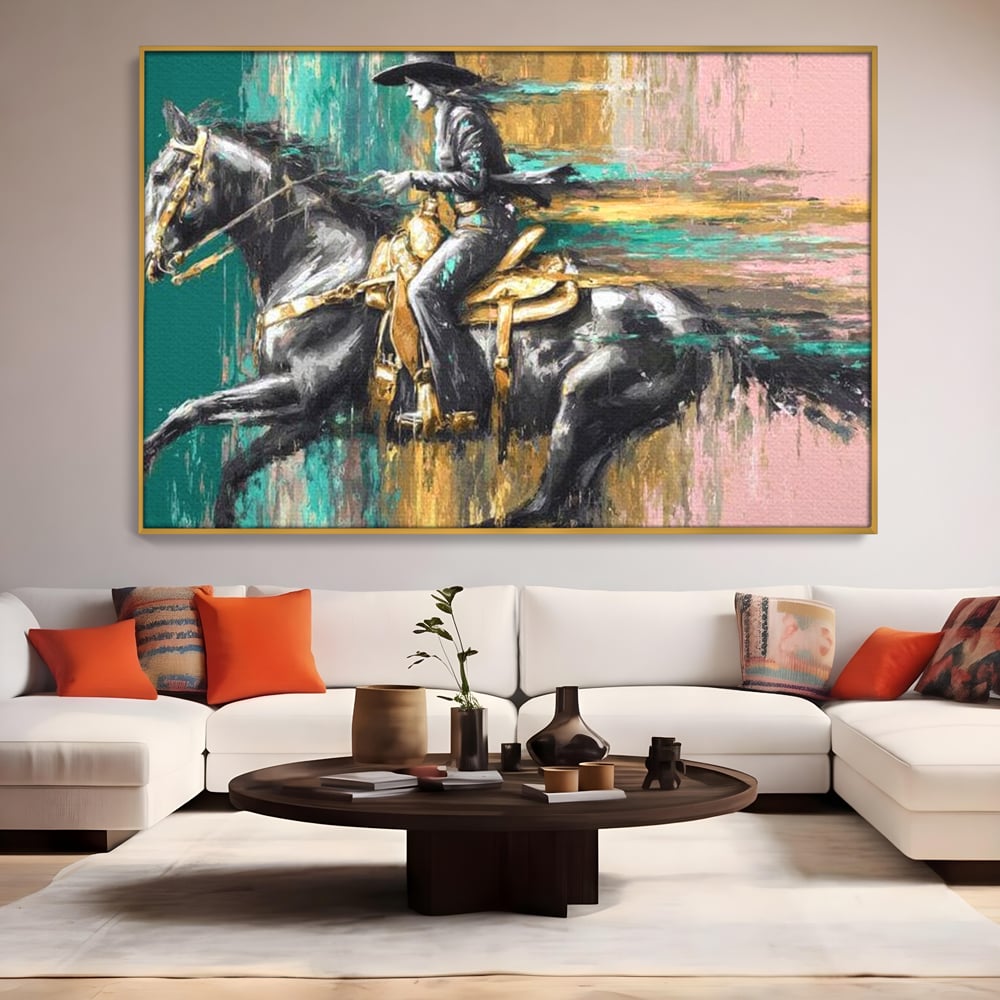 Tablou canvas cu pictura cu femeie calare pe armasar, in rama de aluminiu auriu, pe perete intr-un living