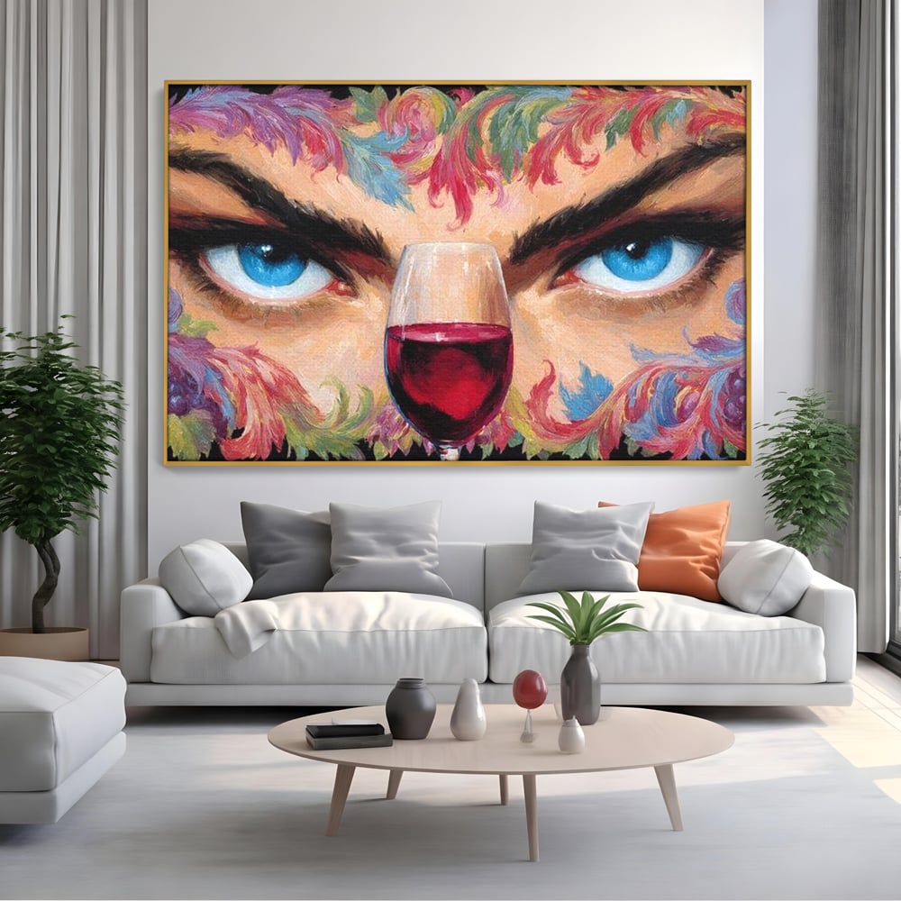 Tablou canvas cu tablou canvas cu ochi albastri si pahar de vin, in rama de aluminiu auriu, pe perete intr-un living
