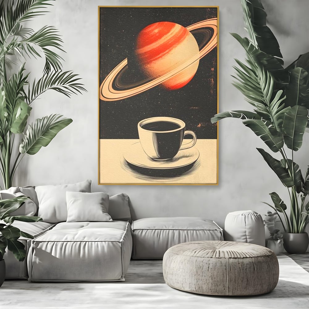 Tablou canvas cu ilustratie cu ceasca de cafea si planeta saturn, in rama de aluminiu auriu, pe perete intr-un living