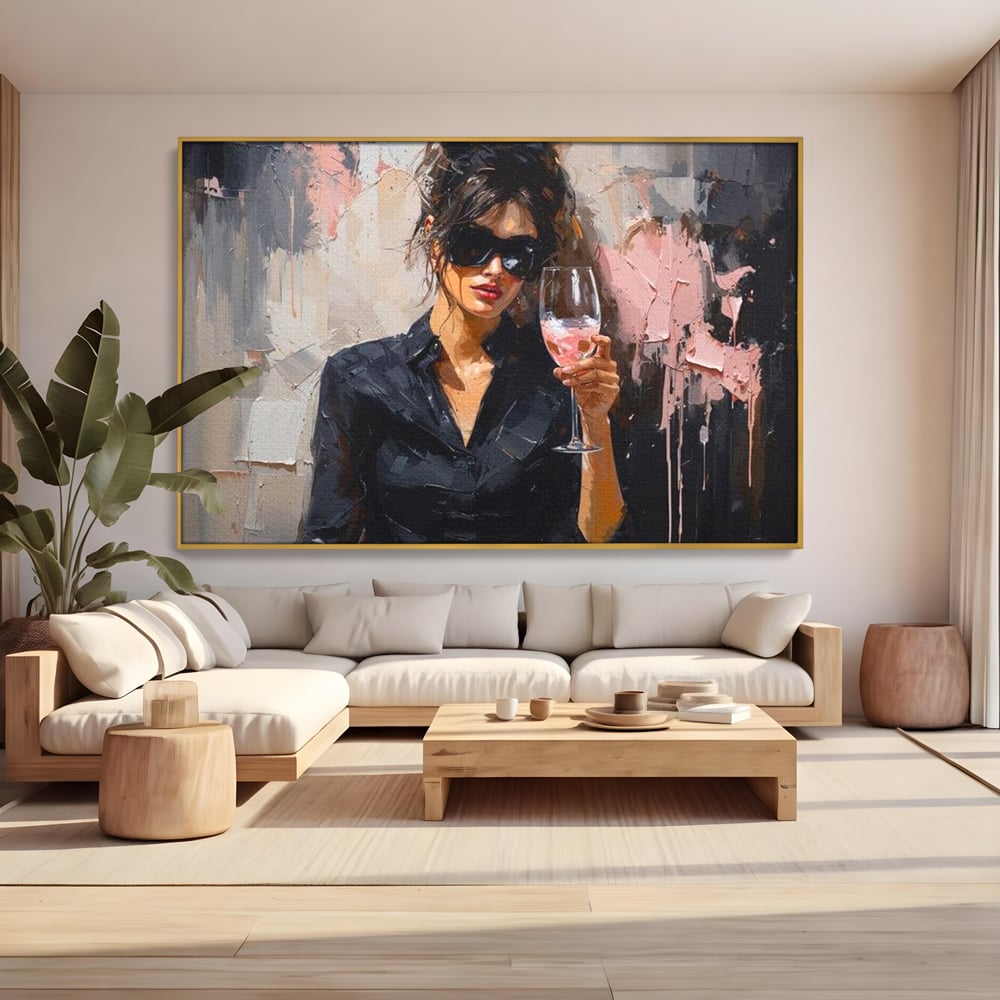 Tablou canvas cu tablou canvas cu femeie si pahar de vin, in rama de aluminiu auriu, pe perete intr-un living