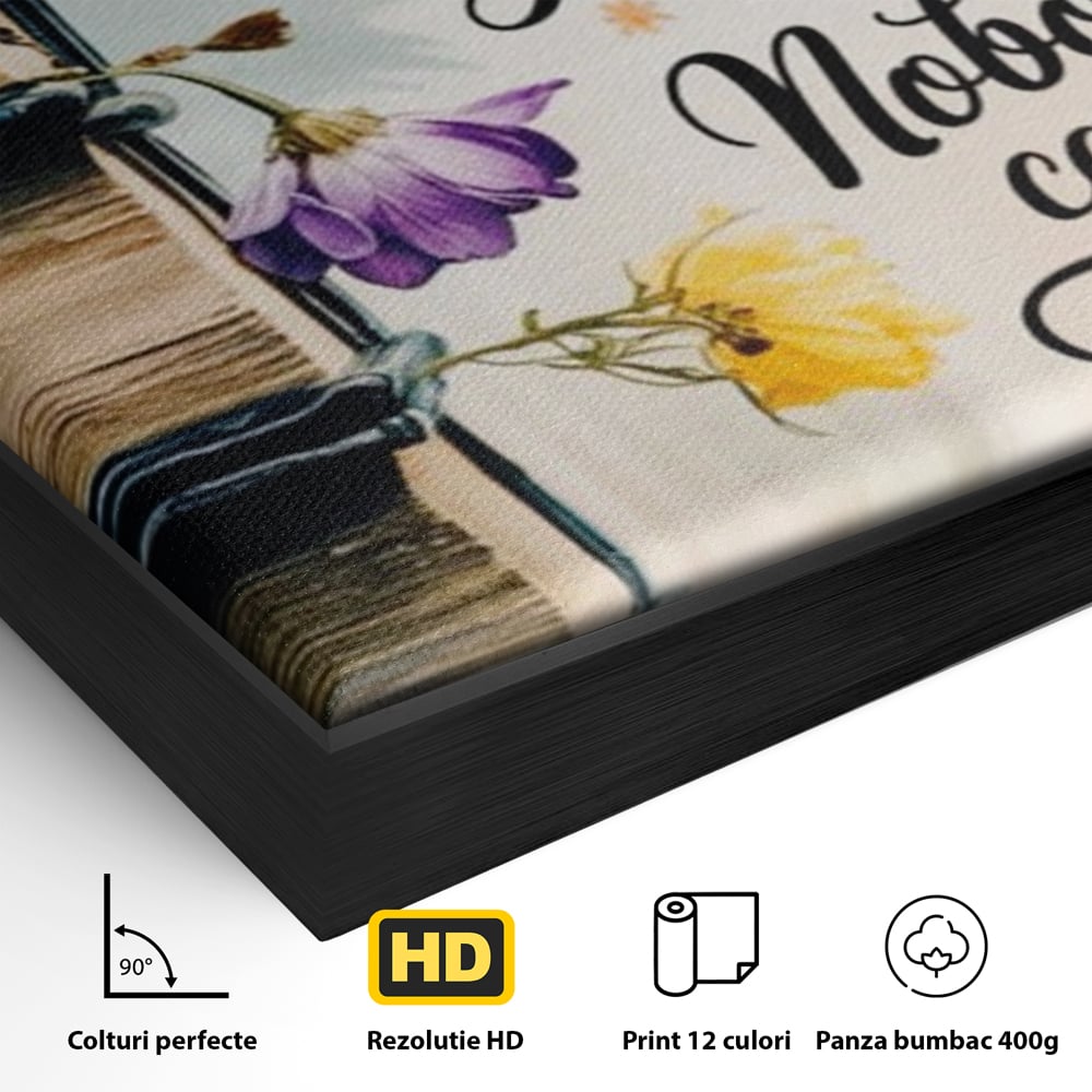 Detaliu al suprafetei: tablou motivational cu teanc de carti si flori, in rama de aluminiu negru