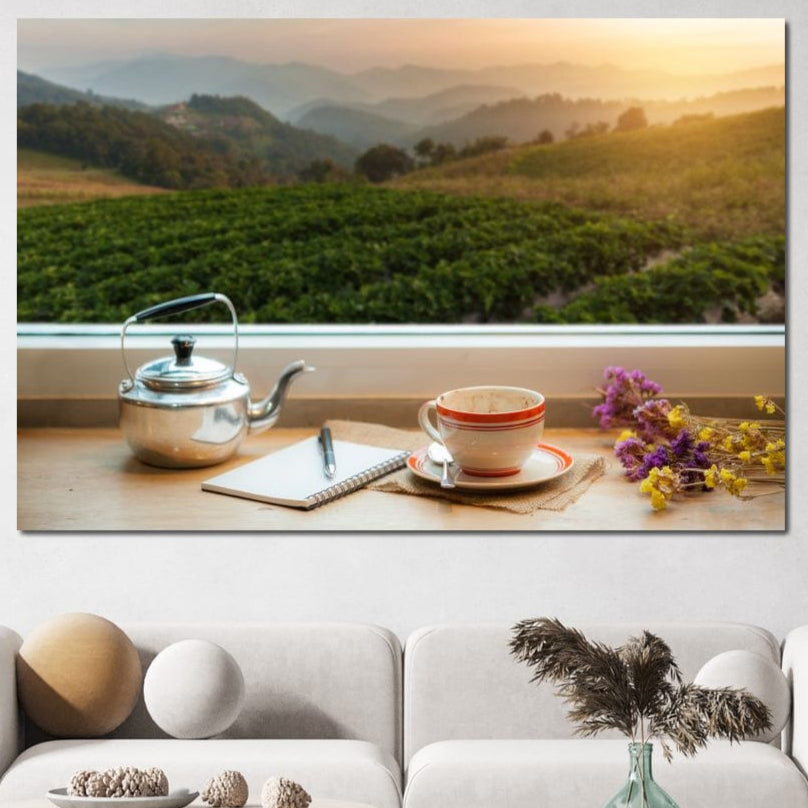 tablou canvas cu o priveliste in natura de la fereastra, cu o ceasca de cafea, flori de camp si un jurnal