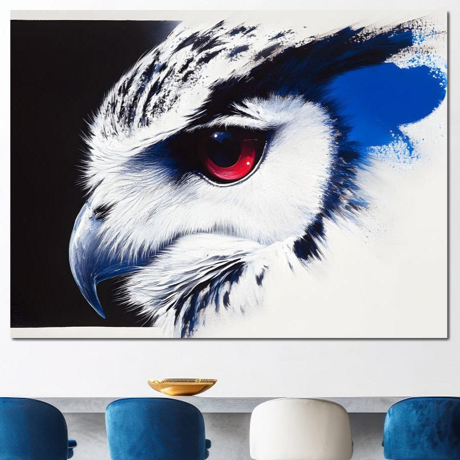 tablou canvas cu o bufnita cu ochii rosii si penajul in stil pictural albastru si alb, pe fundal negru