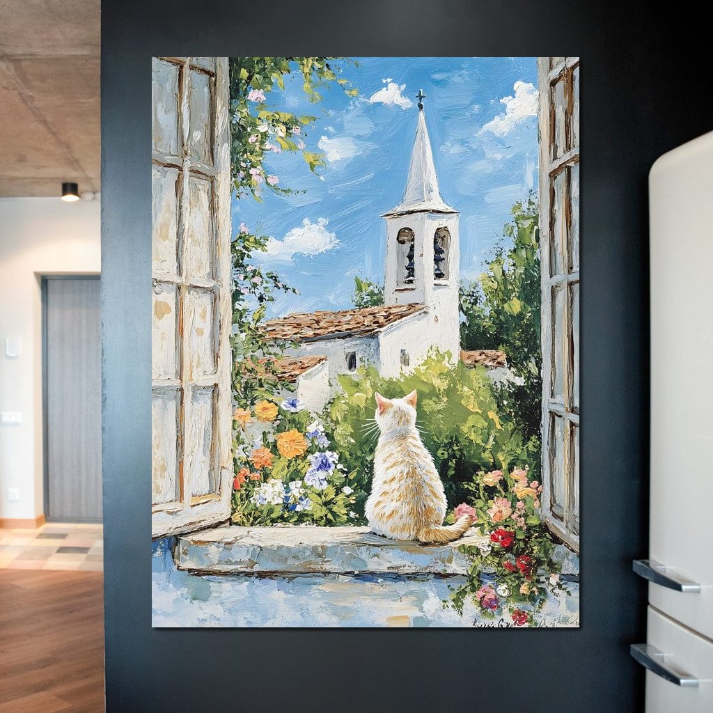 tablou canvas cu o pisica alba la fereastra, privind un turn bisericesc cu clopot, inconjurat de flori si vegetatie intr-un peisaj pictat de primavara