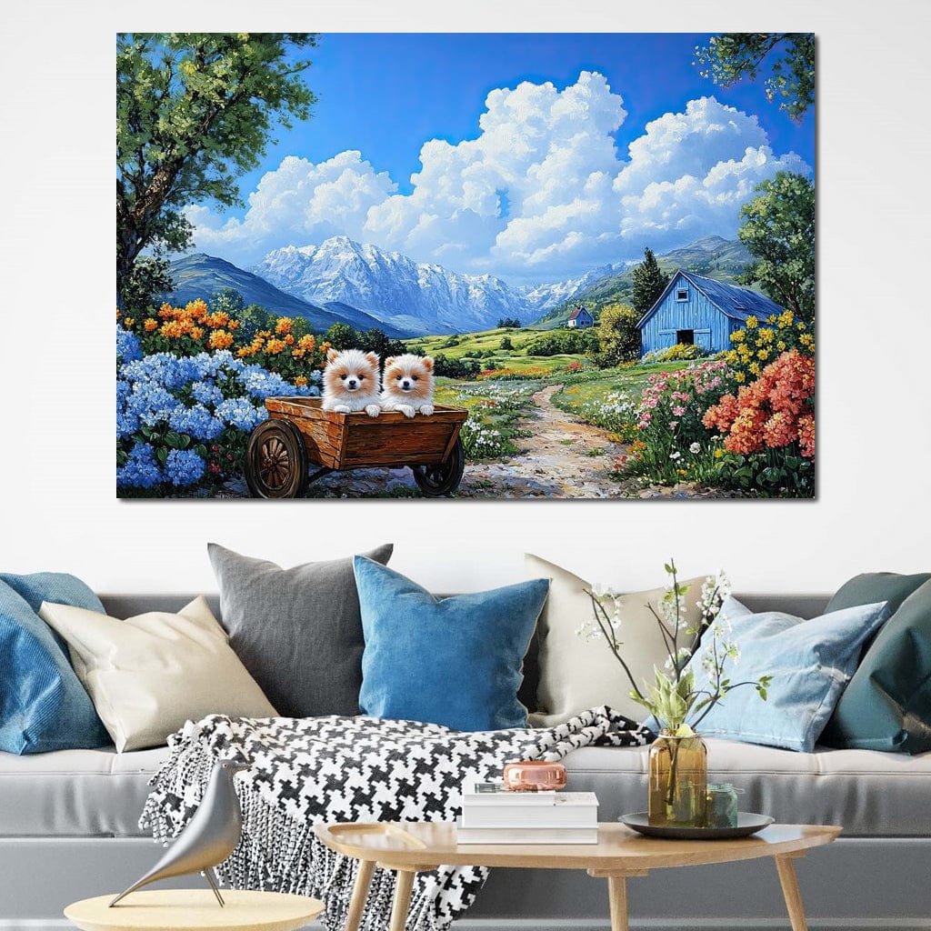 tablou canvas cu doi catei pufosi intr-o roaba de lemn, in mijlocul unei gradini florale montane sub cer senin cu nori pufosi si peisaj rustic