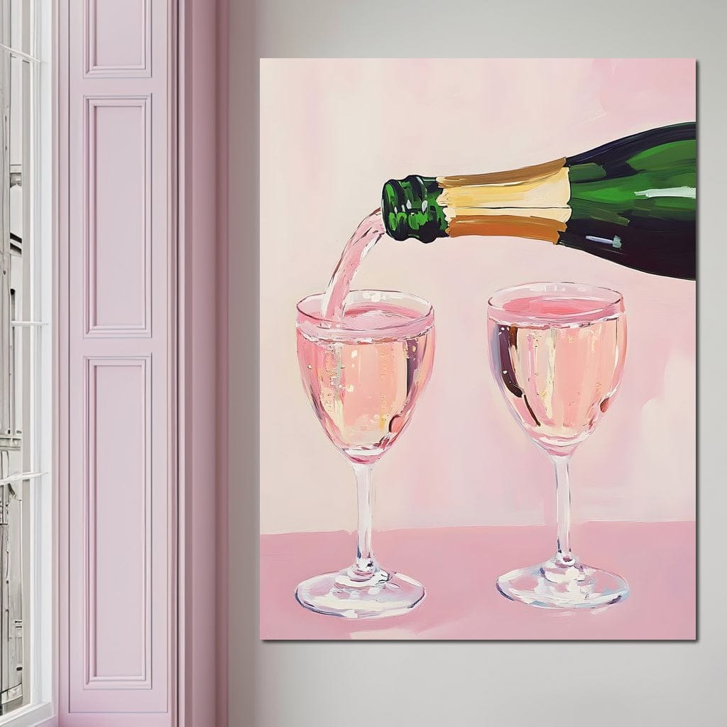 tablou canvas cu o sticla de sampanie, turnand in doua pahare, pe fundal roz pastelat
