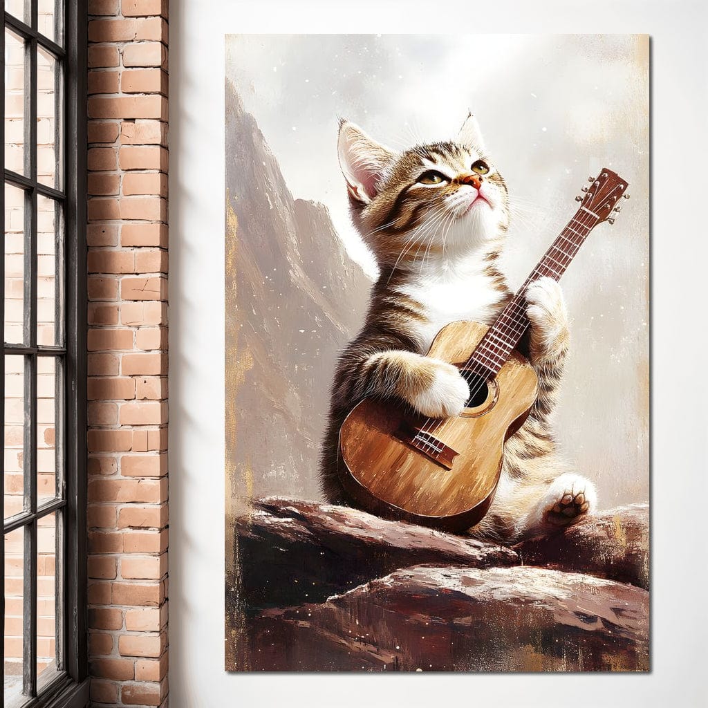 tablou canvas cu un pui de pisica cantand la o chitara, pe o stanca, pe fundal montan in ceata