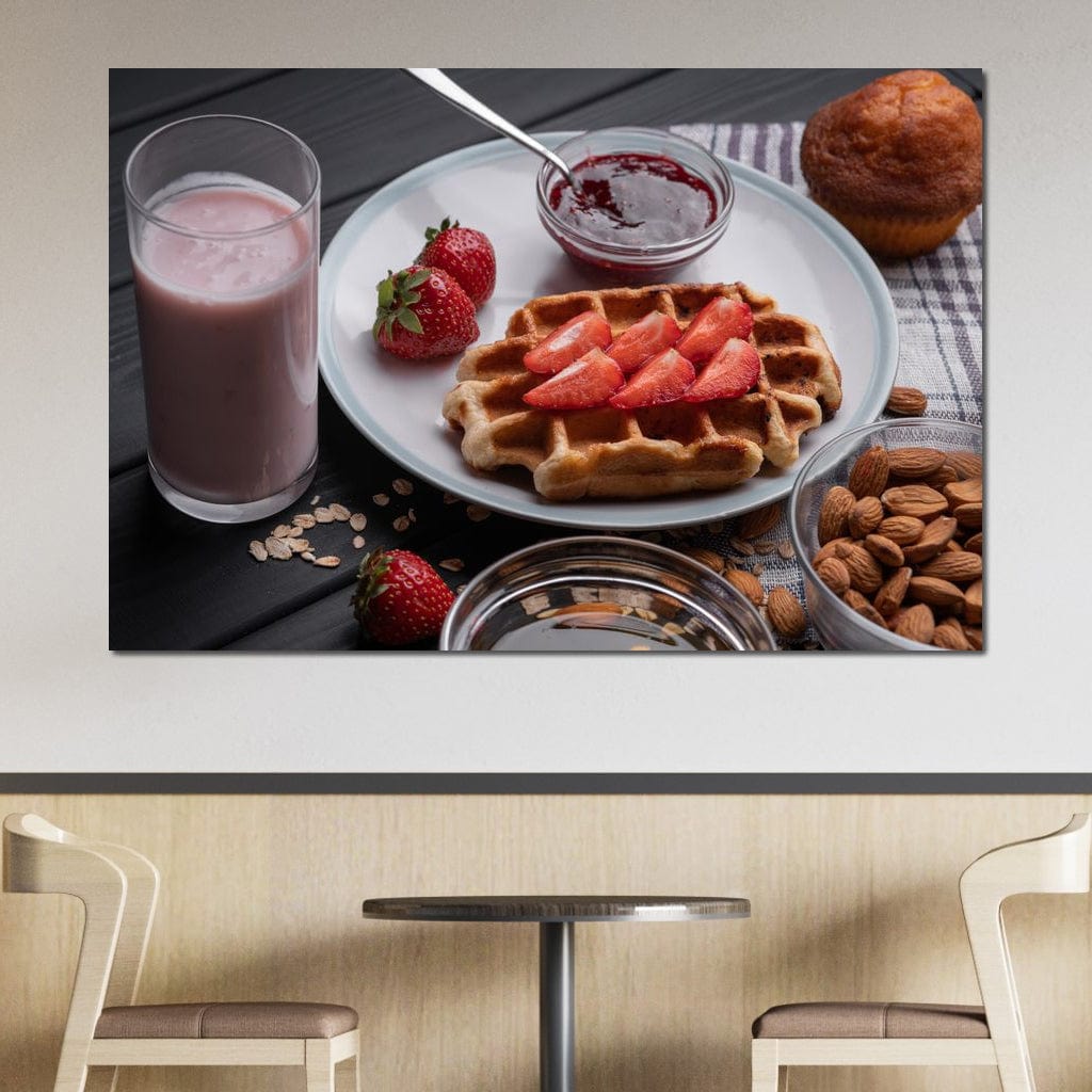 tablou canvas cu un mic dejun dulce, cu o vafa si capsuni, o briosa, migdale si un milkshake, pe o masa de lemn neagra