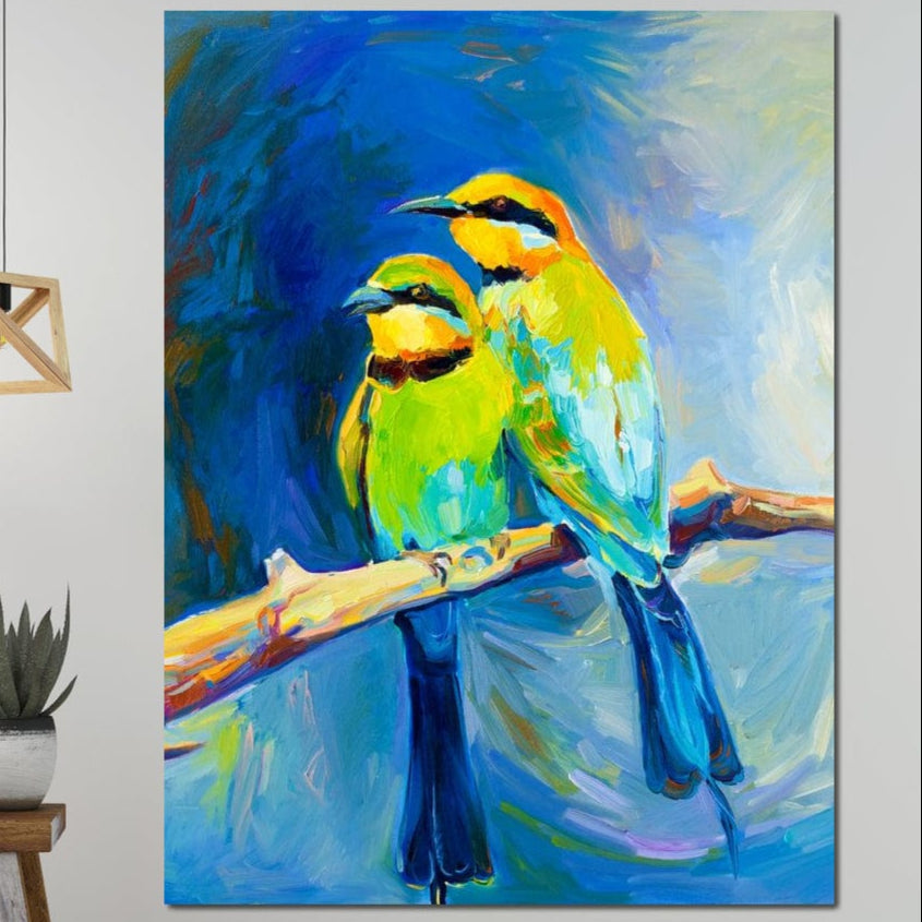 tablou canvas cu doua pasari exotice galben-verzui pe creanga, pe fundal albastru