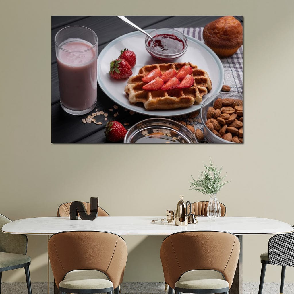tablou canvas cu un mic dejun dulce, cu o vafa si capsuni, o briosa, migdale si un milkshake, pe o masa de lemn neagra