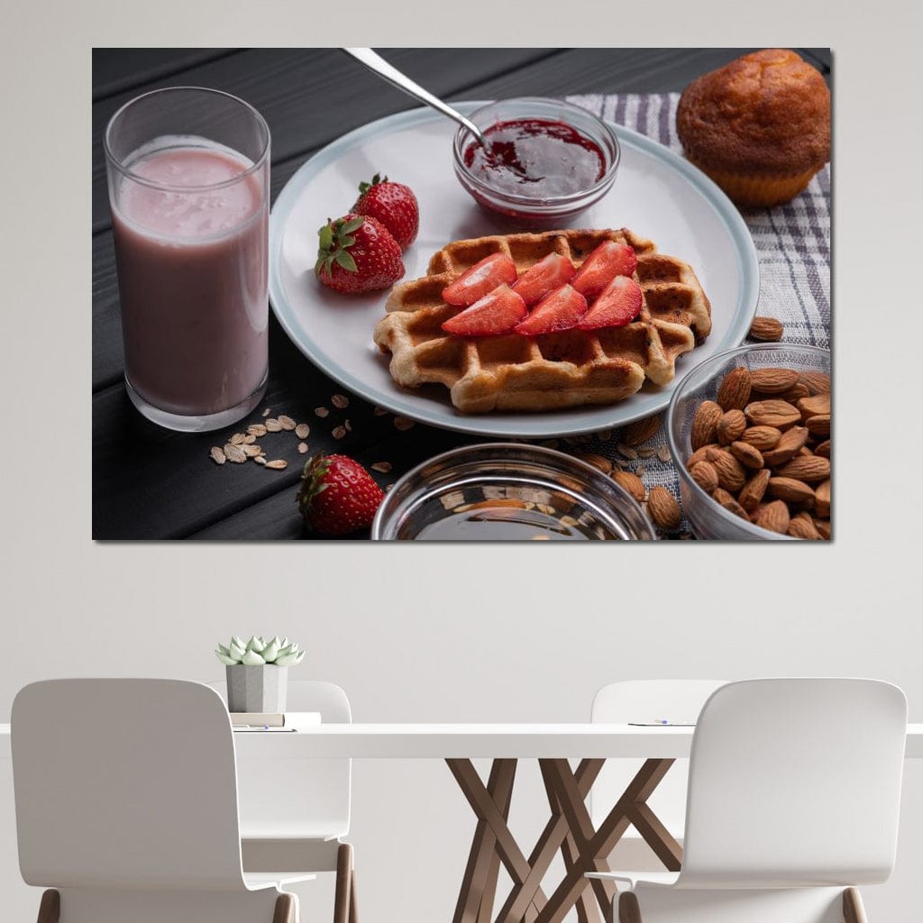 tablou canvas cu un mic dejun dulce, cu o vafa si capsuni, o briosa, migdale si un milkshake, pe o masa de lemn neagra