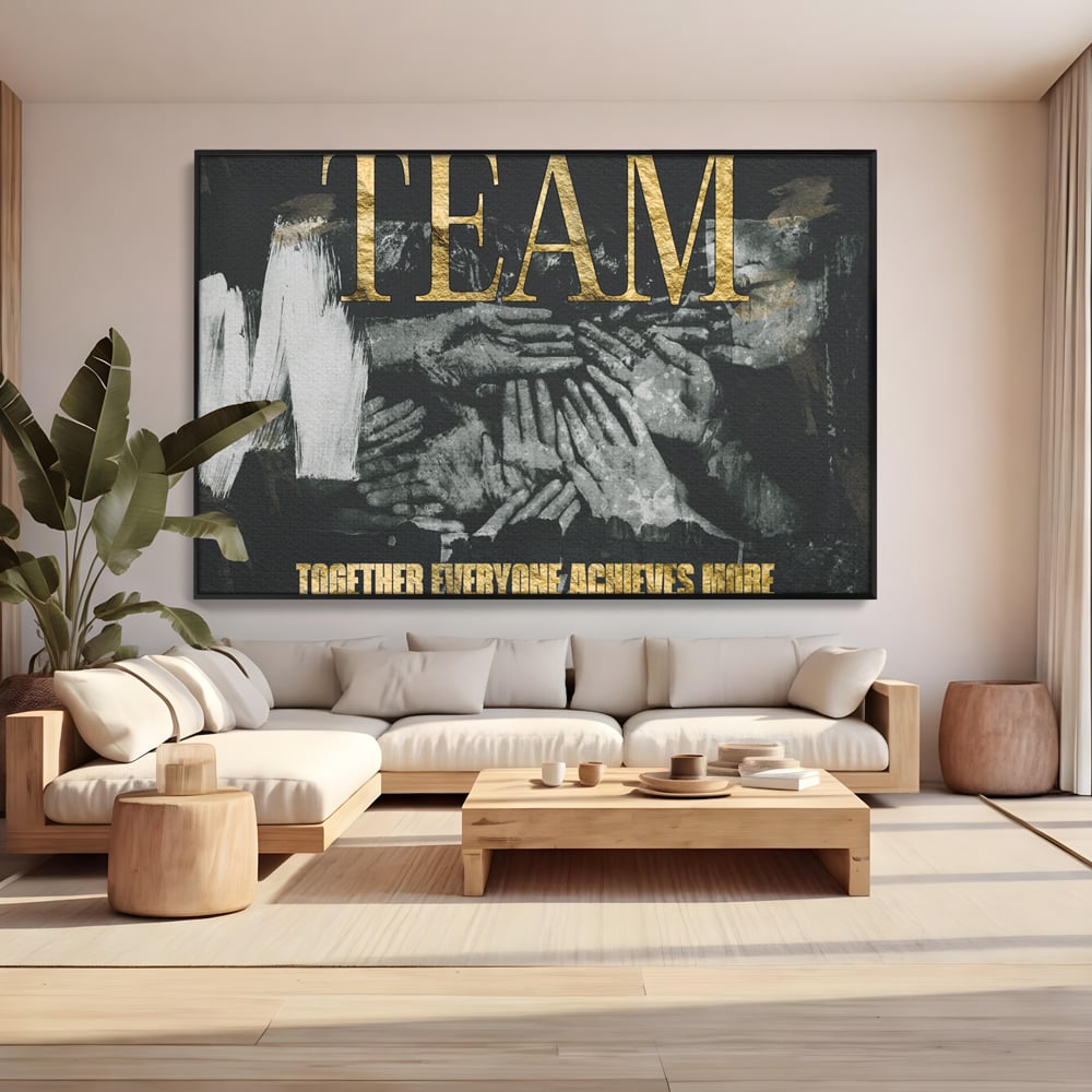 Tablou canvas cu tablou motivational cu maini si text, in rama de aluminiu negru, pe perete intr-un living
