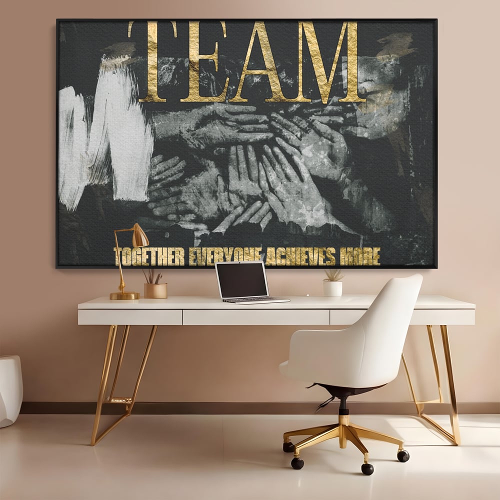 Tablou canvas cu tablou motivational cu maini si text, in rama de aluminiu negru, pe perete intr-un birou