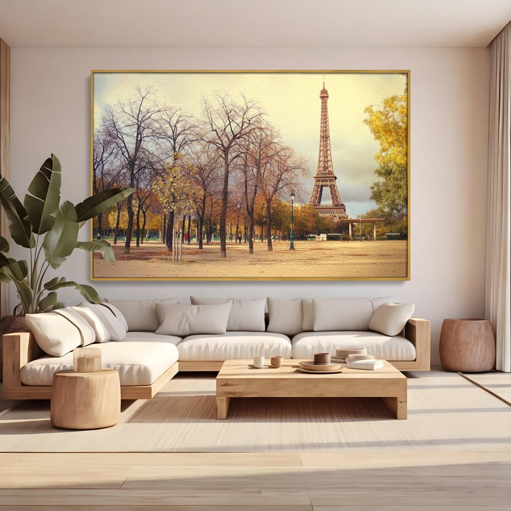 Tablou canvas cu tablou canvas cu turnul eiffel toamna, in rama de aluminiu auriu, pe perete intr-un living