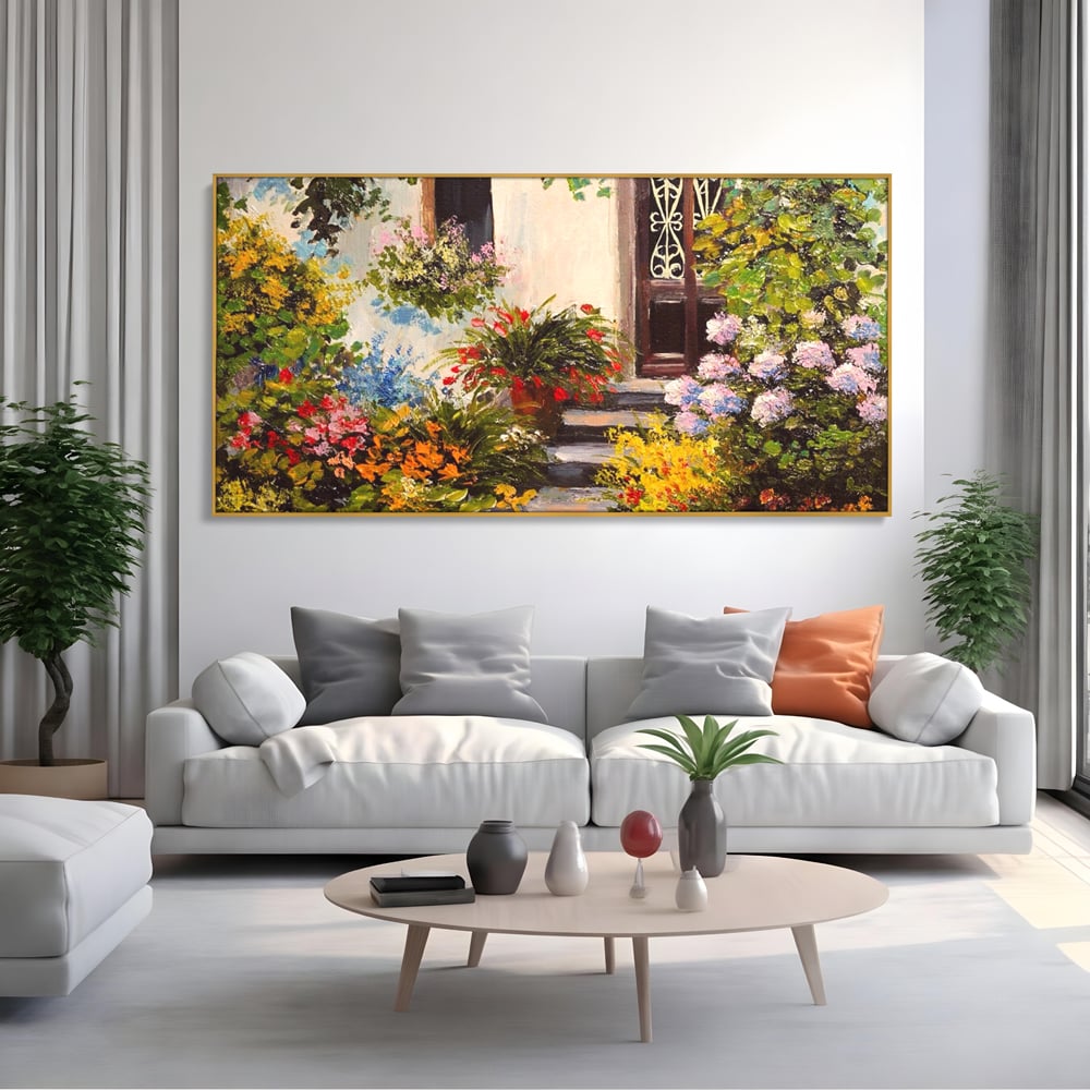 Tablou canvas cu tablou canvas cu alee florala si casa, in rama de aluminiu auriu, pe perete intr-un living