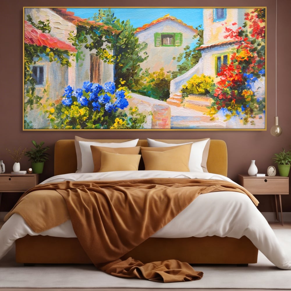 Tablou canvas cu pictura peisaj mediteranean cu case, in rama de aluminiu auriu, pe perete intr-un dormitor