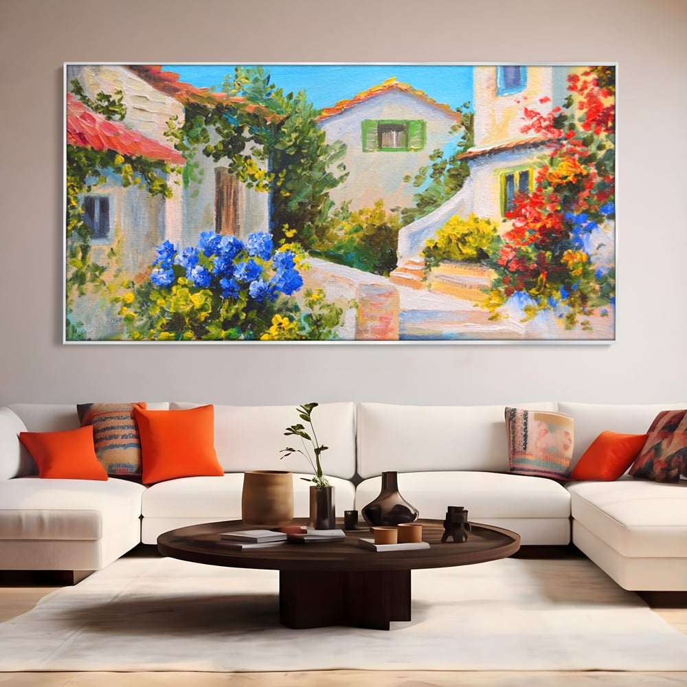 Tablou canvas cu pictura peisaj mediteranean cu case, in rama de aluminiu argintiu, pe perete intr-un living