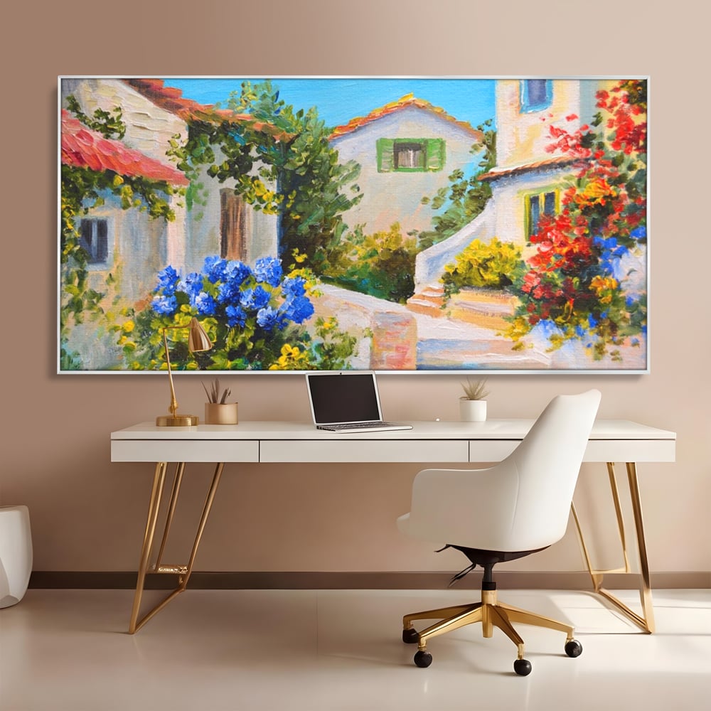 Tablou canvas cu pictura peisaj mediteranean cu case, in rama de aluminiu argintiu, pe perete intr-un birou