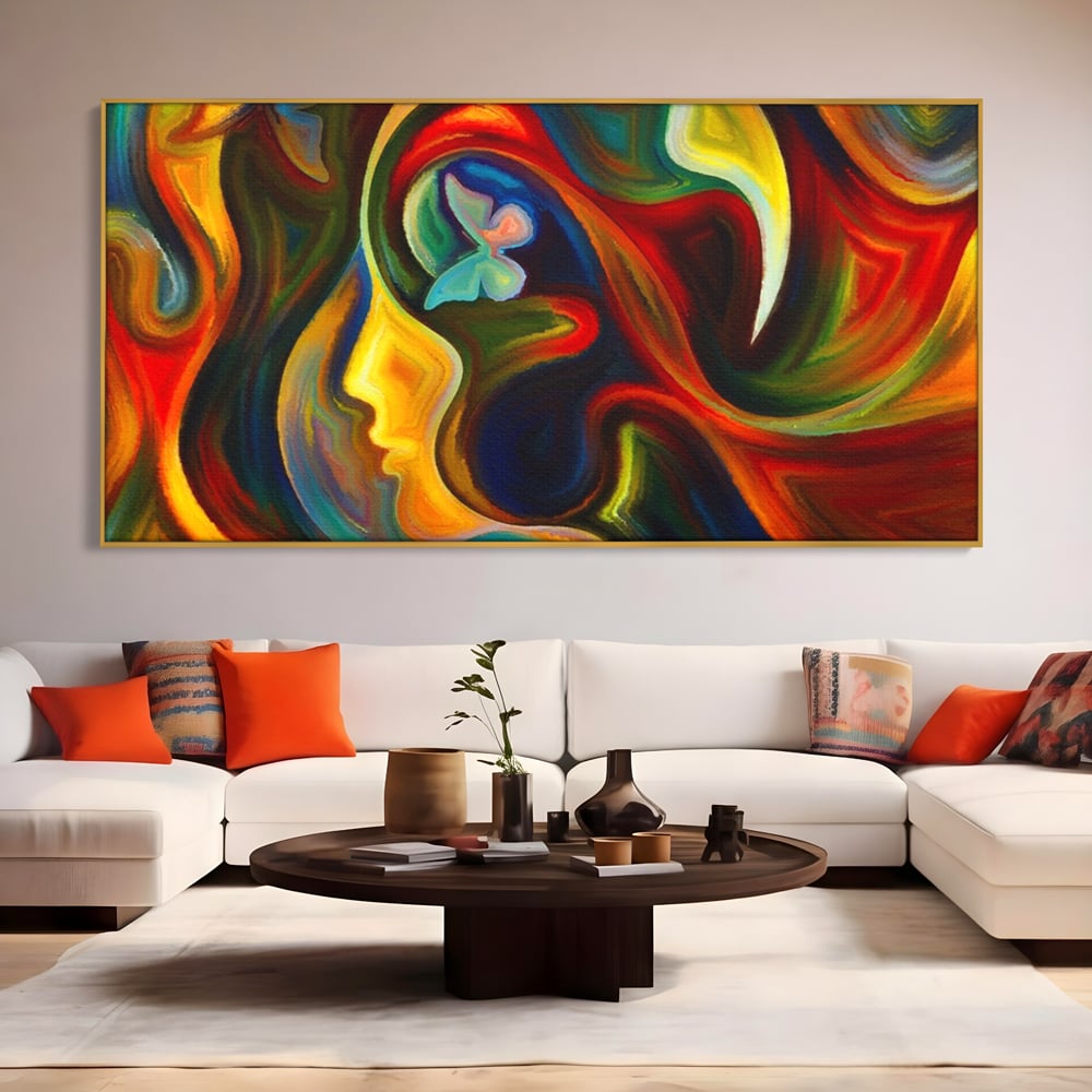 Tablou canvas cu pictura abstracta cu profil uman si fluturi, in rama de aluminiu auriu, pe perete intr-un living