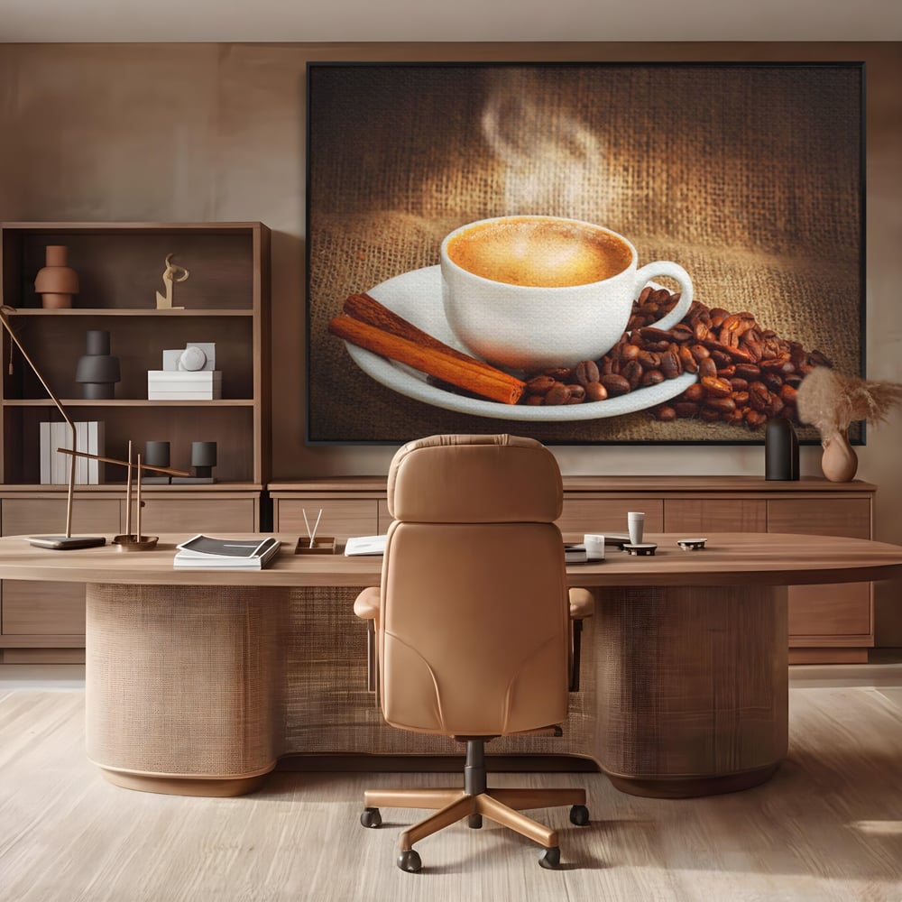 Tablou canvas cu tablou canvas cu ceasca de cafea si scortisoara, in rama de aluminiu negru, pe perete intr-un birou