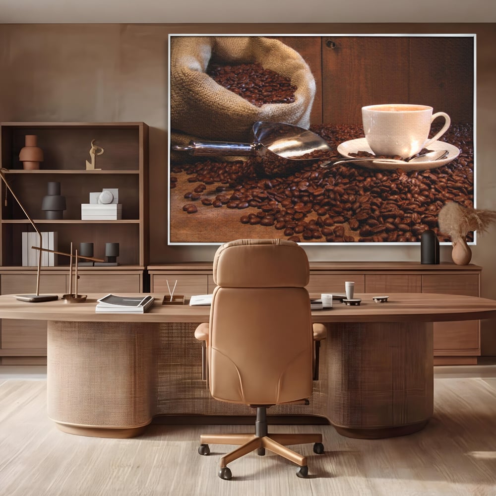 Tablou canvas cu tablou cu cana de cafea si sac de iuta, in rama de aluminiu argintiu, pe perete intr-un birou