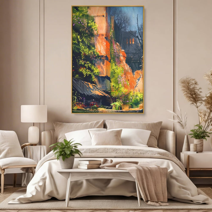 Tablou canvas cu pictura verticala cu ziduri vechi si flori, in rama de aluminiu auriu, pe perete intr-un dormitor