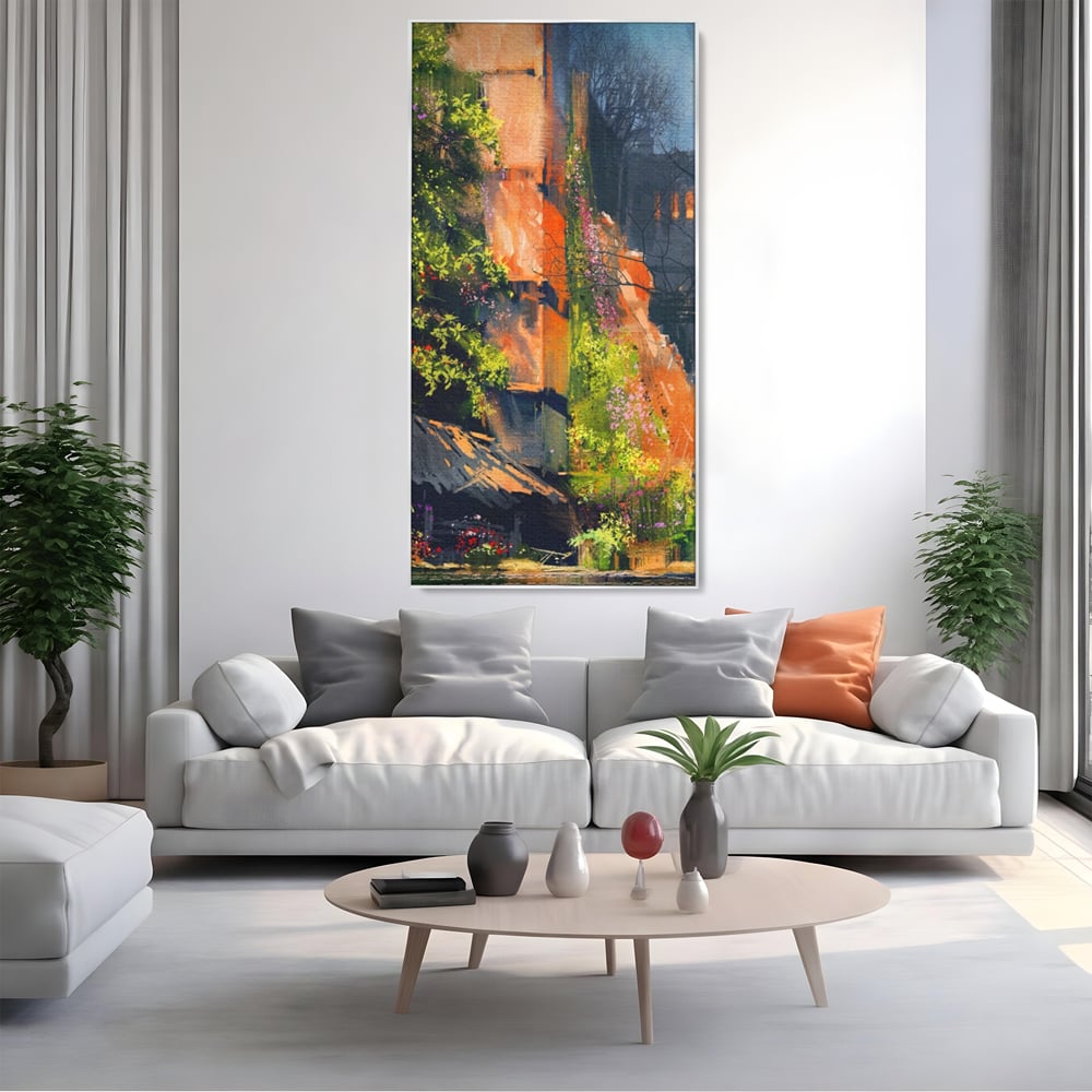 Tablou canvas cu pictura verticala cu ziduri vechi si flori, in rama de aluminiu argintiu, pe perete intr-un living