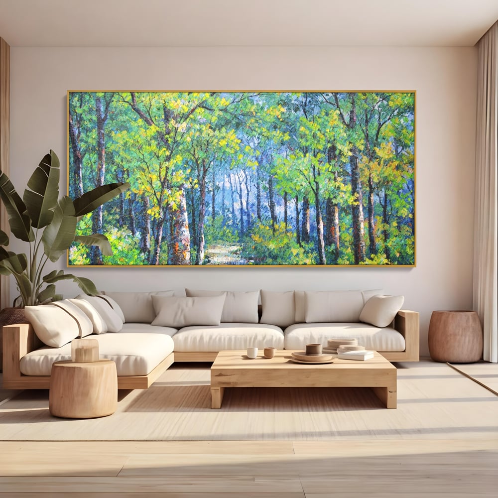 Tablou canvas cu tablou canvas cu peisaj de padure, in rama de aluminiu auriu, pe perete intr-un living