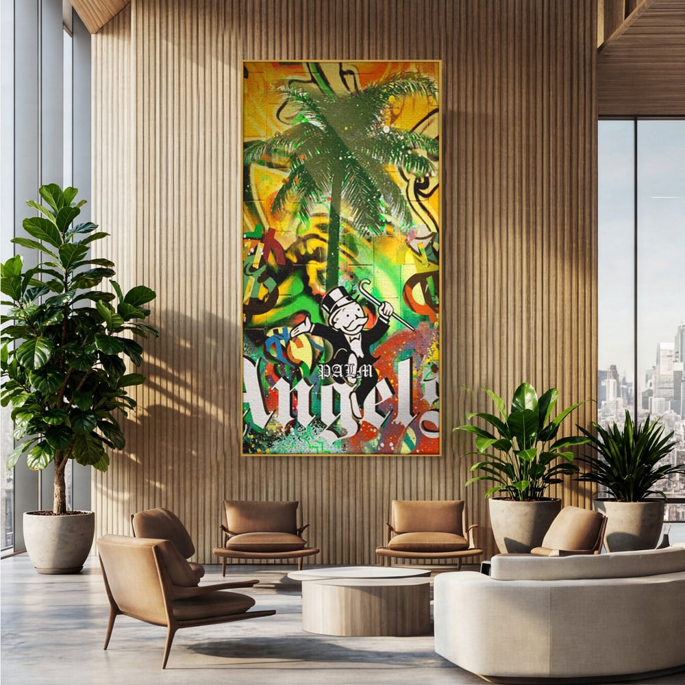 Tablou canvas cu tablou canvas cu graffiti monopoly si palmier, in rama de aluminiu auriu, pe perete intr-un birou