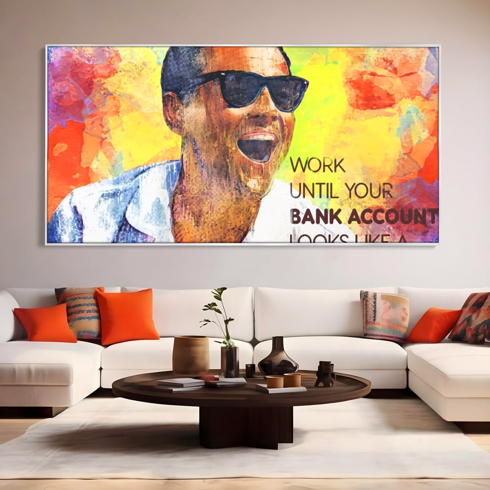 Tablou canvas cu tablou motivational cu portretul lui leo dicaprio, in rama de aluminiu argintiu, pe perete intr-un living
